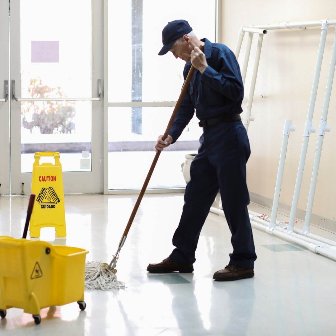 Janitor mopping floor