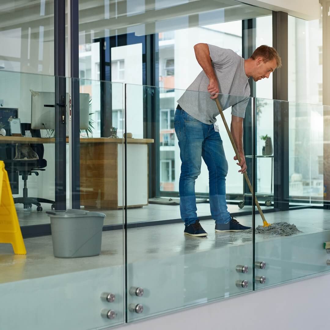 image of a man mopping a floor