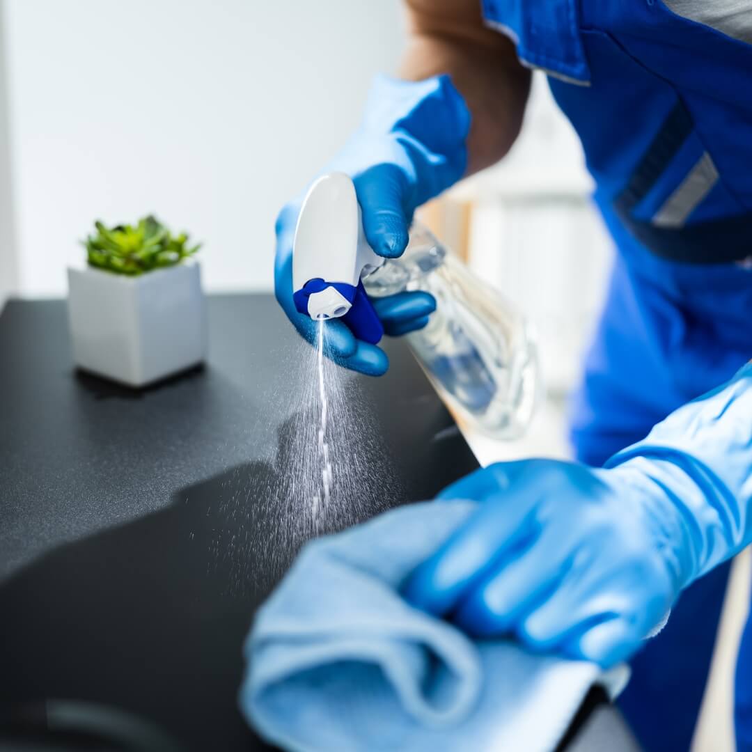 image of a man cleaning a surface