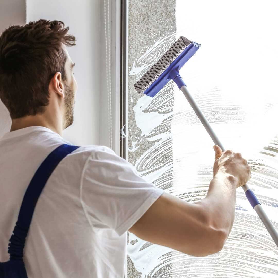 image of a man washing windows