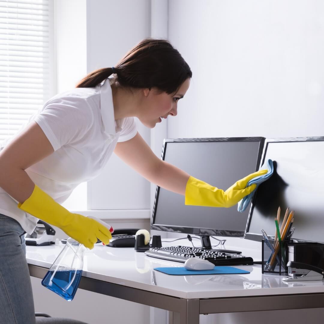 image of a woman cleaning an office