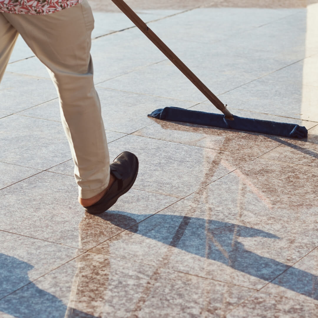 image of a man waxing floors