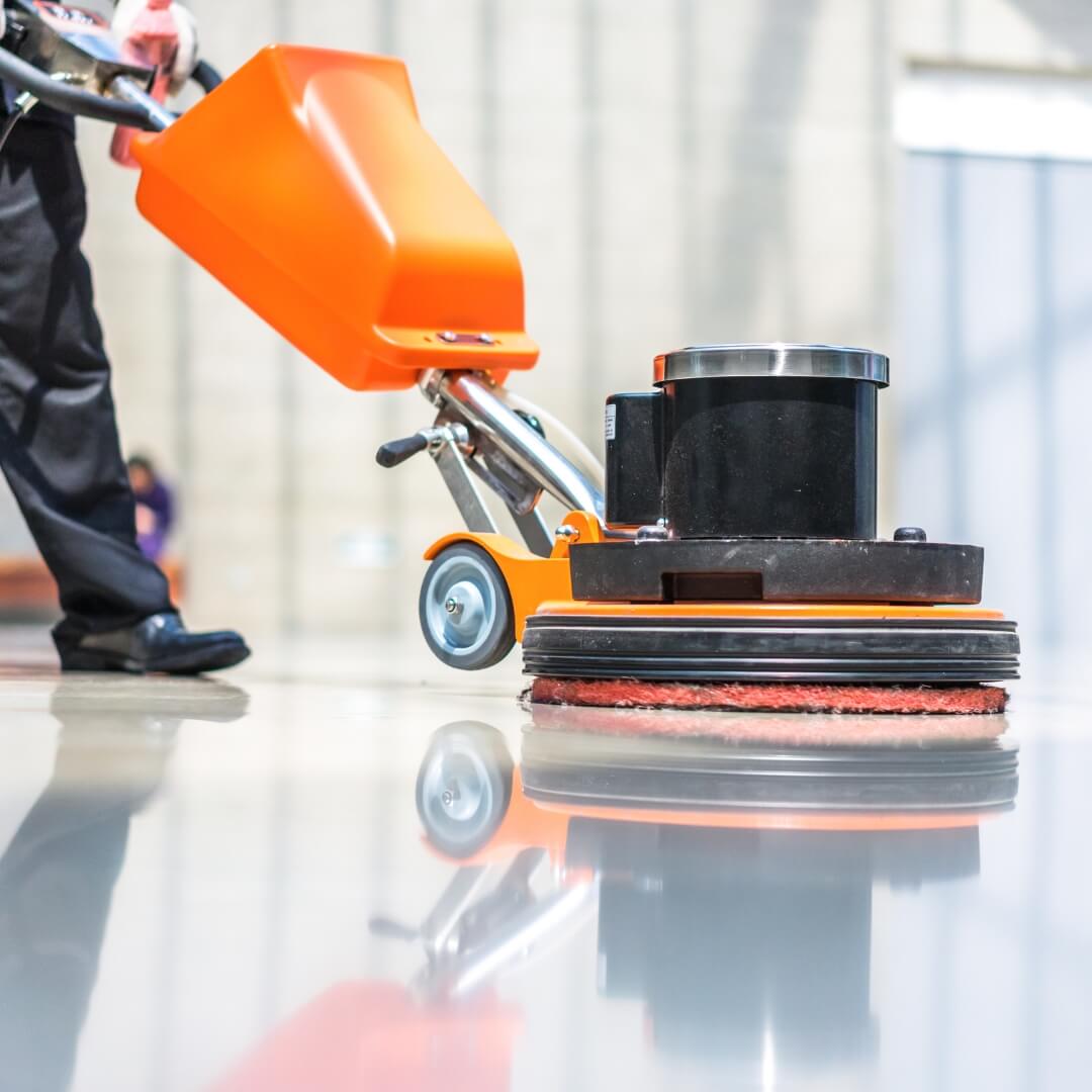 image of a man buffing waxed floors