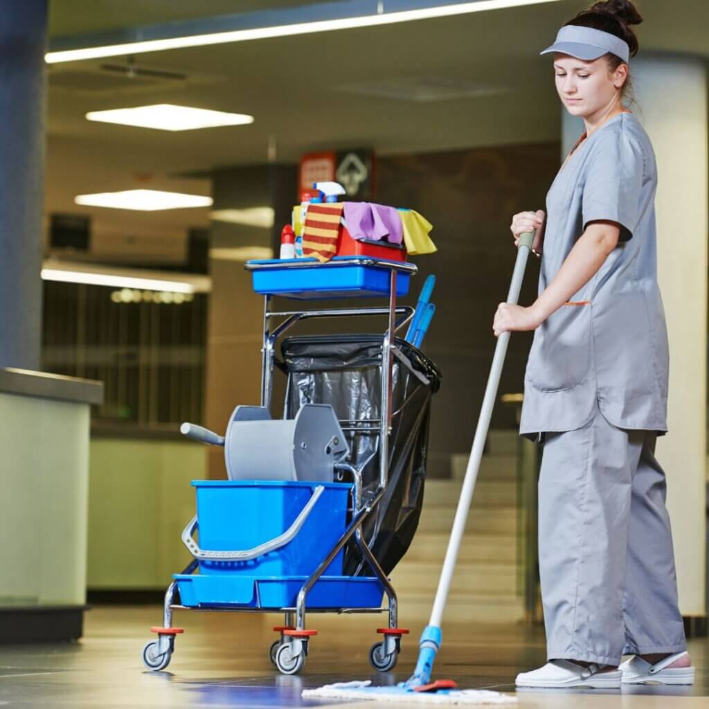 Janitor cleaning the floor of a hospital