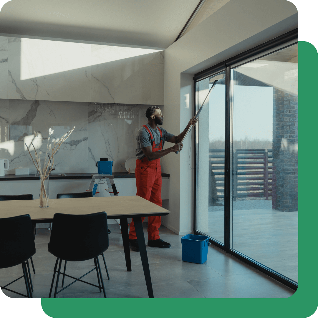 A cleaning expert cleaning glass windows