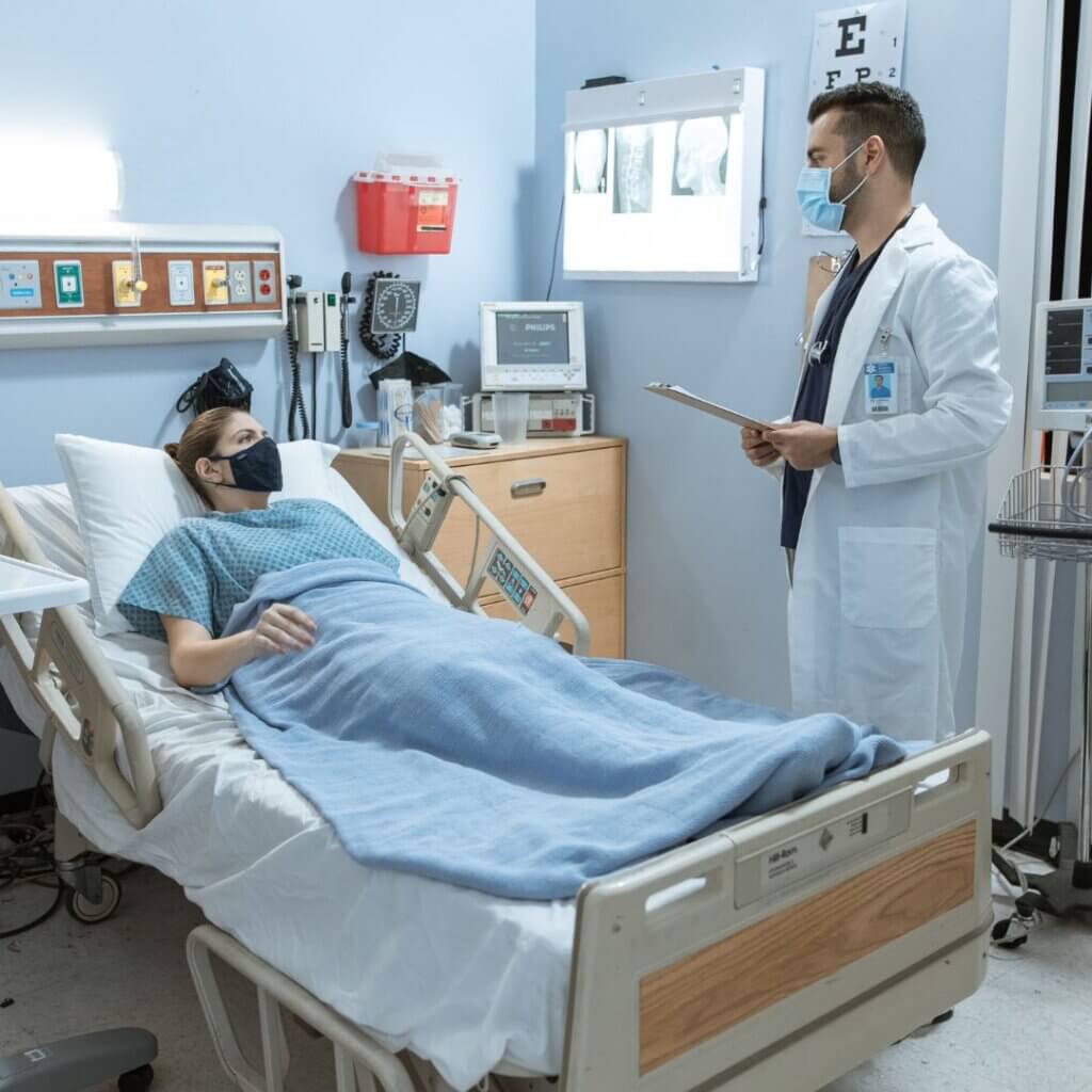 A doctor speaking to a patient