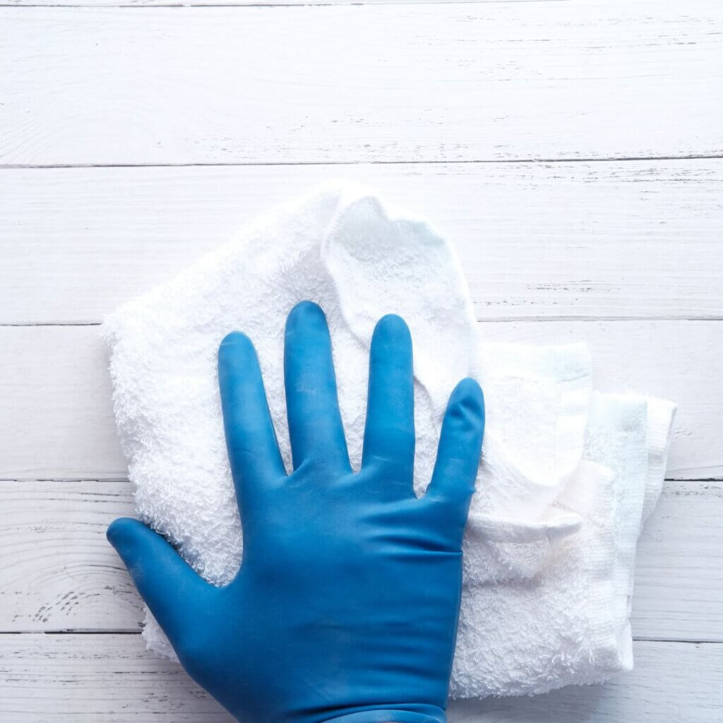 A person wiping down a wall