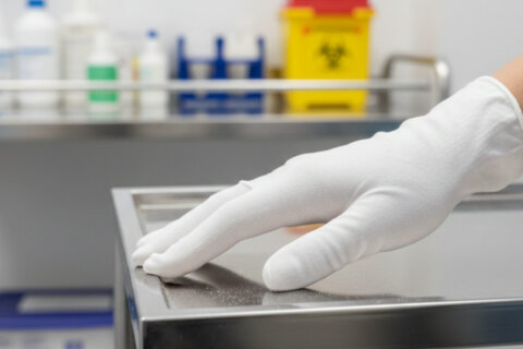 Gloved hand touching a cart