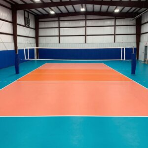 A multi-purpose indoor synthetic sports floor with colorful painted boundary lines for various court games.